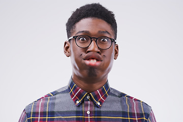 Image showing Funny face, comic and portrait of a black man being crazy isolated on a white background in a studio. Geek, mouth movement and face headshot of an African person with glasses as a nerd and goofy