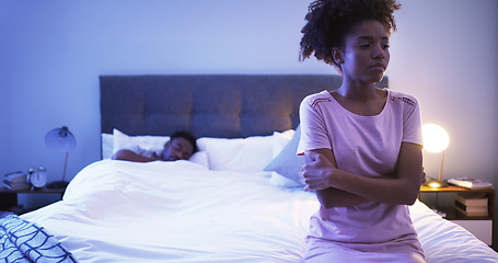 Image showing Black couple, bedroom and night with a woman sad while thinking of divorce, stress or depression. Man sleeping in home bed with partner upset about fight, marriage problem and cheating or infertility