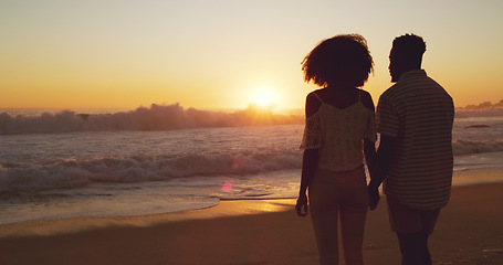 Image showing Man with woman holding hands, beach at sunset and sea with back view, mockup space and travel with couple outdoor. Love, romance and trust with people in commitment, tropical holiday and ocean waves