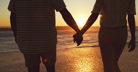 Image showing Couple holding hands, beach at sunset and sea with back view, vacation and travel with man and woman outdoor. Love, romance and trust with people in commitment, tropical holiday and ocean waves