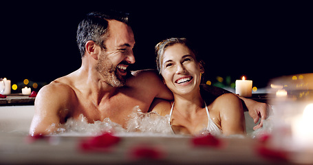 Image showing Spa, love and couple in a jacuzzi happy, smile and relax one date night at a wellness resort. Zen, hot tub and man with woman laughing, peace and enjoying a romantic vacation, holiday or anniversary