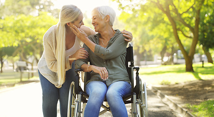 Image showing Hug, woman and senior mother at the park, wheelchair and happiness with joy, weekend break or bonding. Family, mature parent or daughter embrace, outdoor or relax with a smile, disability or recovery