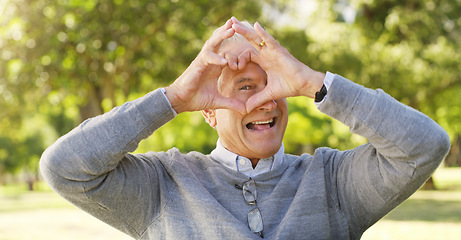 Image showing Portrait, park and senior man with heart hands, happiness and support with review, retirement or relax. Face, mature male person or old guy with symbol for love, outdoor or happy with icon and nature