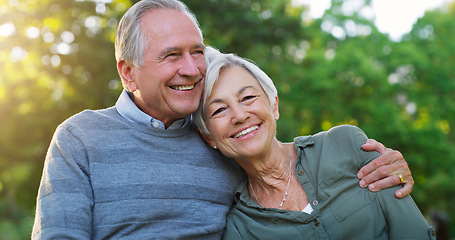 Image showing Love, portrait and senior couple in a garden together hugging with care, happiness and romance. Smile, nature and elderly man and woman in retirement embracing while sitting in an outdoor green park.