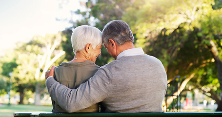 Image showing Senior couple, hug and bench outdoor in a park with love, care and support in marriage. A elderly man and happy woman in nature with a smile for quality time, healthy retirement and freedom to relax