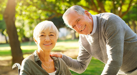 Image showing Senior couple, wheelchair and portrait outdoor at a park with love, care and support for health and wellness. Face of elderly man and woman in nature for quality time, healthy marriage and retirement