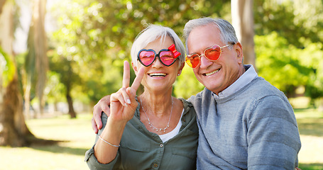 Image showing Funny couple, peace sign and portrait outdoor at a park with love, care and hand emoji. A happy senior man and woman with comic sunglasses in nature for happiness, healthy marriage and retirement fun