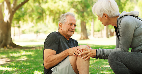Image showing Old couple, man with knee pain and injury outdoor, fibromyalgia health problem and joint ache from exercise. Woman helping, arthritis and people in retirement with fitness in park and mockup space