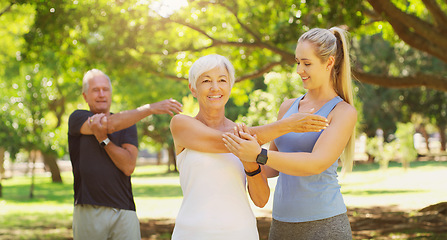 Image showing Yoga, exercise and an old couple with their personal trainer in a park for a health or active lifestyle. Fitness, wellness or zen and senior people outdoor for a workout with their pilates coach