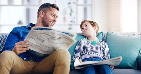 Image showing Father, child and reading newspaper on sofa relaxing together in the living room at home. Happy dad and kid enjoying the news in relax on lounge couch for knowledge on weekend or holiday at the house