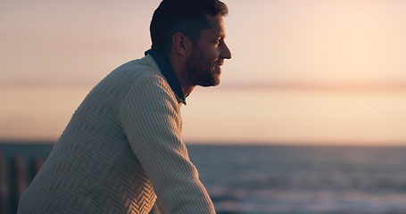 Image showing Profile, sunset and thinking man by beach on vacation or holiday mockup space. Ocean, side view and happy male person relax outdoor by sea for travel, freedom and enjoying summer peace with a smile.