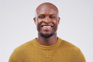 Image showing Portrait, smile and black man with confidence, wellness and casual outfit against grey studio background. Face, male person and guy with happiness, carefree and joyful with mockup, beauty and fashion