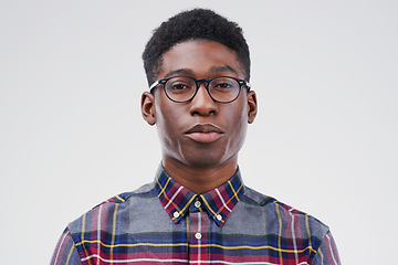 Image showing Face portrait, serious geek and black man in studio isolated on white background. African, nerd and male person with glasses from South Africa with fashion, style and pose with clothes for confidence