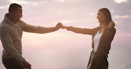 Image showing Dancing, couple and sunset sky at beach for happy memory on vacation, holiday or adventure. A man and woman dance to celebrate love, marriage and travel journey or date with a smile outdoor in nature