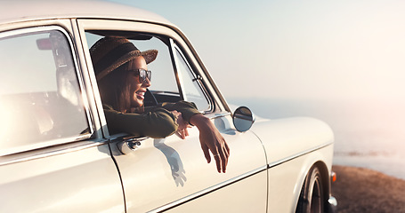 Image showing Road trip, window and view with a woman in a car for travel, freedom or a joyride as a tourist on the coast. Nature, sunset and relax with a young female traveler taking a drive outdoor for adventure