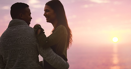 Image showing Couple, hug and sunset sky at the beach for happy memory on vacation, holiday or adventure. A man and woman together for love, marriage and travel or date by ocean in nature with outdoor mockup space