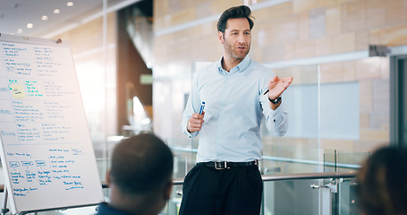 Image showing Business man, speaker and board at conference, presentation or workshop with question, writing and talk. Leader, coach and mentor with whiteboard, training and advice for team in meeting room