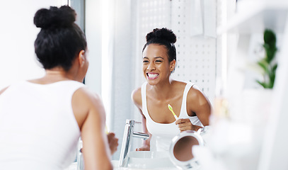 Image showing Woman check teeth in mirror, cleaning mouth with toothbrush and toothpaste, morning routine in bathroom. Dental, health and oral hygiene, female person grooming with fresh breath and wellness at home