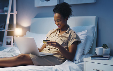 Image showing Credit card, woman and night in a bed with online shopping and happiness from purchase. Bedroom, internet store and ecommerce deal of a African female person in a home trying to pay on a web app