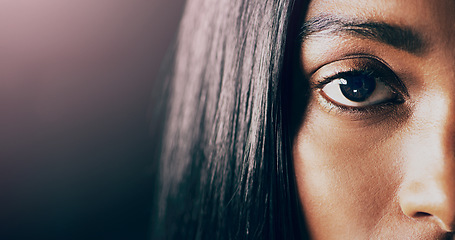 Image showing Portrait, closeup and woman with mockup, eye and health against a dark studio background. Face, female person and model with focus, retina and clear vision with eyebrow, lashes and microblading