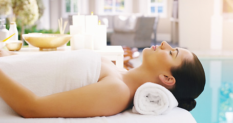 Image showing Woman, relax and massage bed at spa for zen, physical therapy or healthy wellness at a resort. Calm female person, sleeping or relaxing in peace, luxury body treatment or self love at hotel or salon