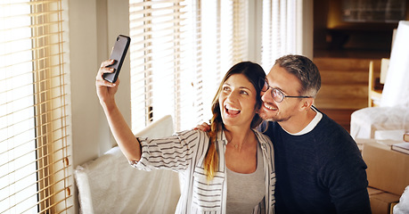 Image showing Couple, moving and boxes with selfie, new house or excited for start, love or beginning in real estate. Man, woman and happy with smile, photography or profile picture for home, property or apartment