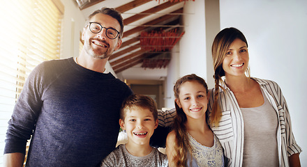 Image showing Portrait, children and parents as a homeowner family moving house for a new start after real estate purchase. Mom, dad and kids with a group of people in the living room of their property investment