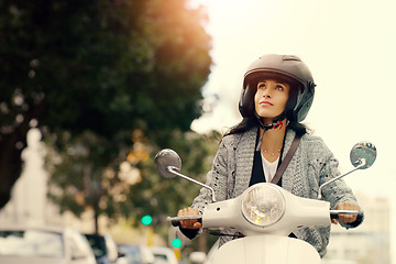 Image showing Woman, motorcycle and transport in city, street and safety with helmet, journey and travel with mock up space. Girl, motorbike and scooter in metro cbd with thinking, vacation and freedom in traffic