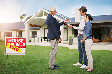 Image showing Couple, real estate and realtor with keys to new home, payment or mortgage loan on lawn outside. Happy man and woman in relationship or homeowners with agent for buying property, sale or sold house