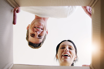 Image showing Moving box, couple portrait and cardboard opening gift for new home and real estate property. Young people, smile and delivery surprise with a present packing from house and apartment from below