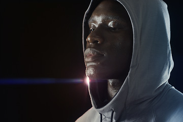 Image showing Fitness, workout and face of black man with sweat in dark for running, exercise and marathon training. Sports mockup, thinking and serious male person in hoodie with dedication, motivation and focus