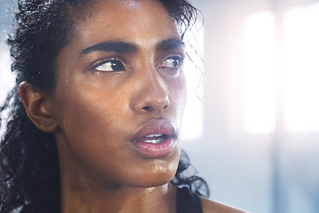 Image showing Sweating, woman and breathing while taking a break from fitness, exercise and workout. Gym, Indian female person and serious face of an athlete after sports and wellness club training for health