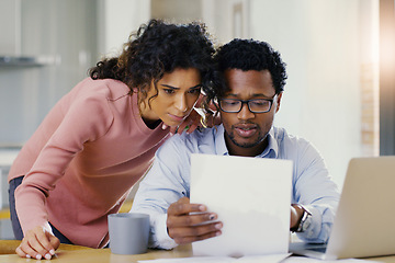 Image showing Couple, document and finance in budget planning, bills or expenses together in the kitchen at home. Serious man and woman person working on paperwork in financial, mortgage or investment strategy