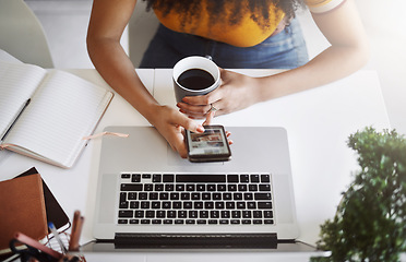 Image showing Coffee, top view of businesswoman with a cellphone and laptop by her desk in modern office. Networking or technology, communication and black woman with smartphone on social media at workplace