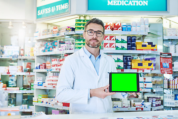 Image showing Man, pharmacist and tablet with green screen in store for product, empty and pharmaceutical promo on app. Mature pharma expert, digital touchscreen and space with chromakey for mock up in portrait