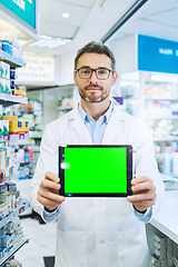 Image showing Man, pharmacy and tablet with green screen with healthcare, shop or mockup for pharmaceutical promo on app. Mature pharma expert, digital touchscreen and space with chromakey for mock up in store