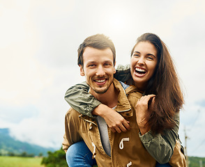 Image showing Laugh, love and piggyback with portrait of couple in nature for happy, smile and bonding. Happiness, relax and care with man carrying woman on countryside date for spring, vacation and support