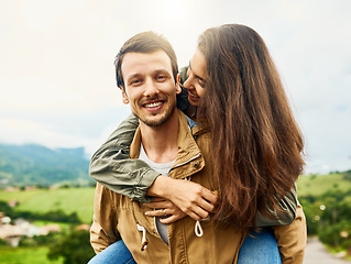 Image showing Relax, love and piggyback with couple in nature for happy, smile and bonding. Happiness, playful and care with portrait of man carrying woman on countryside date for spring, vacation and support