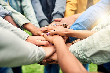 Image showing Friends, community and stack of hands of people for motivation, support and friendship goal outdoor. Teamwork, diversity and men and woman huddle together for trust, commitment and solidarity in park