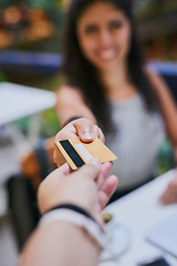 Image showing Woman, hands and credit card payment at a cafe or waiter in restaurant for transaction or customer ready for purchase and at coffee shop. Bills, finance and lady client or cashier and shopping person