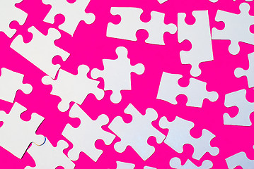Image showing Puzzle Pieces On Pink