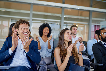 Image showing Business, applause and conference for an agreement and support at a presentation with office team. Seminar, professional and workshop congratulations with smile at a meeting with an audience at work.