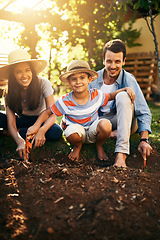 Image showing Happy family, soil or plant in garden for sustainability, agriculture care or farming development. Backyard, learning natural growth or parents of boy child with sand or planting for teaching a child