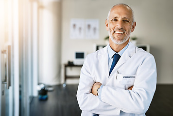 Image showing Mature doctor, clinic and portrait with arms crossed in hospital feeling proud from medical work. Healthcare, wellness and professional employee with happiness from health support and physician job