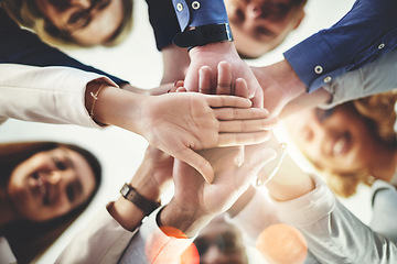 Image showing Team, hands of colleagues together and smile with huddle for collaboration for goal with lens flare. Teamwork or cooperation, businesspeople or coworkers and happy people with hand for support