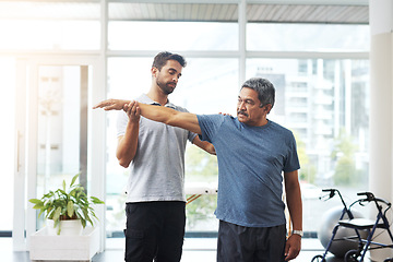 Image showing Physiotherapy, stretching and arm with old man and doctor for training, rehabilitation and injury. Medical, healing and healthcare with expert and patient for consulting, help and fitness