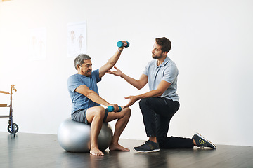 Image showing Dumbbells, physiotherapy and exercise with doctor and old man for rehabilitation, training and balance. Health, pain and healing with senior patient and physiotherapist for consulting, muscle or help