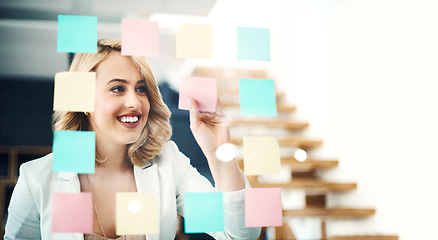 Image showing Happy business woman, brainstorming and sticky note for planning target, goals and agenda at glass window. Face of female worker smile for schedule, ideas and mindmap of vision, objectives and mockup