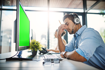 Image showing Businessman, call center and headache with green screen in burnout, stress or overworked at office. Man person, consultant or agent with bad head pain or anxiety with mockup chromakey at workplace