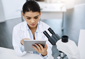 Image showing Research, scientist and woman with tablet in laboratory for medical study online. Technology, science and female doctor with touchscreen for website, healthcare and reading, check results or analysis